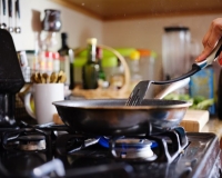Cooking over a stove top, Joshua Resnick/shutterstock.com