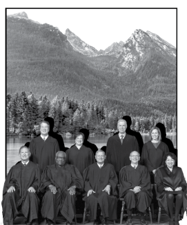The Supreme Court Justices in front of mountain scenery